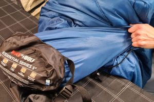 How to attach sleeping bag to backpack
